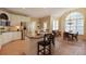 Spacious kitchen with stainless steel appliances, breakfast bar, and adjacent dining area at 415 Westlake Nw Ct, Marietta, GA 30064