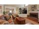 Comfortable living room with a fireplace, built-in shelving, and an open view to the kitchen at 415 Westlake Nw Ct, Marietta, GA 30064