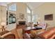 Spacious living room with a brick fireplace, built-in shelving, and abundant natural light at 415 Westlake Nw Ct, Marietta, GA 30064