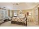 Comfortable main bedroom features tray ceiling, fan, and large windows at 415 Westlake Nw Ct, Marietta, GA 30064