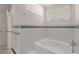 This bathroom includes a white tub with a tiled wall at 1105 Crest Valley Dr, Sandy Springs, GA 30327