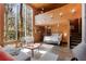 Open floor plan bedroom with large windows and nature view at 1105 Crest Valley Dr, Sandy Springs, GA 30327
