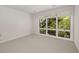 Neutral bedroom with carpet and natural light from large windows at 1105 Crest Valley Dr, Sandy Springs, GA 30327