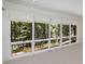 This bonus room includes a large window with a forest view at 1105 Crest Valley Dr, Sandy Springs, GA 30327