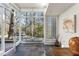 Bright and airy entrance with slate floors, modern bench, and glass brick accent at 1105 Crest Valley Dr, Sandy Springs, GA 30327