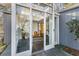 Stylish home entrance featuring glass doors, stone floors, and a modern design at 1105 Crest Valley Dr, Sandy Springs, GA 30327