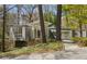 Beautiful exterior view of modern home with unique architecture and wooded lot at 1105 Crest Valley Dr, Sandy Springs, GA 30327