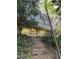 Exterior view of the house with surrounding trees and front yard at 1105 Crest Valley Dr, Sandy Springs, GA 30327