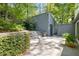 Exterior view of backyard pool house with steps to the main house at 1105 Crest Valley Dr, Sandy Springs, GA 30327