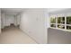 Hallway with carpet and view into bright room at 1105 Crest Valley Dr, Sandy Springs, GA 30327