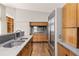 Bright kitchen with stainless steel appliances, granite countertops, and hardwood floors at 1105 Crest Valley Dr, Sandy Springs, GA 30327