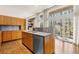 Bright kitchen with hardwood floors, modern wood cabinets, and oversized windows with lots of natural light at 1105 Crest Valley Dr, Sandy Springs, GA 30327