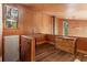 A bright loft space features hardwood floors, wood paneled walls and multiple windows at 1105 Crest Valley Dr, Sandy Springs, GA 30327