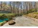Outdoor stone patio perfect for entertaining with natural views at 1105 Crest Valley Dr, Sandy Springs, GA 30327