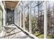Sunroom with floor-to-ceiling windows offering scenic views of surrounding trees at 1105 Crest Valley Dr, Sandy Springs, GA 30327