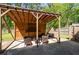 Covered patio with seating area, outdoor grill, and privacy fence at 1650 Randee Nw St, Atlanta, GA 30318