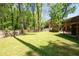 Expansive fenced backyard with mature trees, offering plenty of room for recreation and relaxation at 1650 Randee Nw St, Atlanta, GA 30318