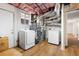 Unfinished basement with laundry area, water heater, and storage space at 1650 Randee Nw St, Atlanta, GA 30318