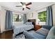 Charming bedroom features a ceiling fan, natural light, and calming blue decor at 1650 Randee Nw St, Atlanta, GA 30318