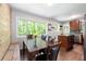 Bright dining room featuring a wood accent wall and modern table set at 1650 Randee Nw St, Atlanta, GA 30318