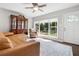 Cozy living room with a large window, sofa, and decorative cabinet at 1650 Randee Nw St, Atlanta, GA 30318