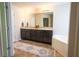 Bathroom featuring a separate tub, tile floor, long vanity with double sinks and a long mirror at 175 Diamond Ridge Ave, Canton, GA 30114