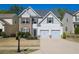 Charming two-story home with a well-manicured lawn and a two-car garage at 175 Diamond Ridge Ave, Canton, GA 30114