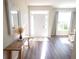 Inviting foyer with hardwood floors, a decorative bench, and plenty of natural light at 175 Diamond Ridge Ave, Canton, GA 30114