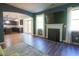Open-concept living room with fireplace and hardwood floors at 175 Diamond Ridge Ave, Canton, GA 30114