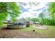 Expansive backyard featuring an above ground pool and fire pit for outdoor entertaining at 238 Knob Hill Dr, Locust Grove, GA 30248