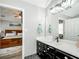 Bathroom vanity with granite countertop seen from the doorway to the bedroom at 238 Knob Hill Dr, Locust Grove, GA 30248