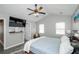 Main bedroom featuring gray walls, a ceiling fan, and plenty of natural light at 238 Knob Hill Dr, Locust Grove, GA 30248