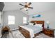 Main bedroom boasts a ceiling fan, neutral walls, and ample natural light at 238 Knob Hill Dr, Locust Grove, GA 30248