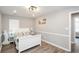 Bedroom featuring gray walls and trim, a comfortable bed, and ample closet space at 238 Knob Hill Dr, Locust Grove, GA 30248