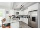 Contemporary kitchen with granite countertops, stainless steel appliances, and modern lighting at 238 Knob Hill Dr, Locust Grove, GA 30248