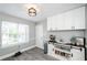 Charming eat-in kitchen features modern cabinets and a built-in coffee bar at 238 Knob Hill Dr, Locust Grove, GA 30248