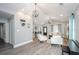 Bright living room featuring modern lighting, contemporary decor, and open layout at 238 Knob Hill Dr, Locust Grove, GA 30248