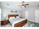 Vaulted ceiling bedroom featuring ceiling fan, painting, and wood floors at 238 Knob Hill Dr, Locust Grove, GA 30248