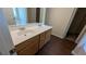 Bathroom vanity with double sinks and a wood cabinet at 2432 Pendergrass Ln, Ellenwood, GA 30294