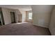 Large bonus room with neutral walls, carpet and natural light at 2432 Pendergrass Ln, Ellenwood, GA 30294