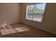Cozy bedroom featuring natural light and neutral walls and carpet at 2432 Pendergrass Ln, Ellenwood, GA 30294