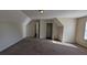 Large bonus room with neutral walls, carpet and natural light at 2432 Pendergrass Ln, Ellenwood, GA 30294
