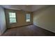 Spacious bedroom with two windows providing plenty of natural light at 2432 Pendergrass Ln, Ellenwood, GA 30294