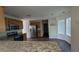 Open concept kitchen with granite countertops, stainless steel appliances, and modern lighting at 2432 Pendergrass Ln, Ellenwood, GA 30294