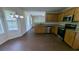 Updated kitchen with granite countertops, stainless steel appliances, and modern cabinetry at 2432 Pendergrass Ln, Ellenwood, GA 30294