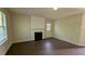 Cozy living room with a fireplace and natural light at 2432 Pendergrass Ln, Ellenwood, GA 30294