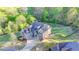 Beautiful aerial view of a home nestled on a large lot with mature trees and manicured lawns at 4155 Winterberry Rd, Cumming, GA 30040