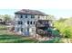 Spacious backyard featuring a two-story deck, perfect for outdoor entertaining and relaxation at 4155 Winterberry Rd, Cumming, GA 30040