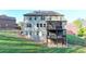 Spacious backyard featuring a two-story deck, perfect for outdoor entertaining and relaxation at 4155 Winterberry Rd, Cumming, GA 30040