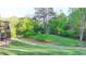 Lush backyard offering ample space for recreation and enjoyment of nature at 4155 Winterberry Rd, Cumming, GA 30040